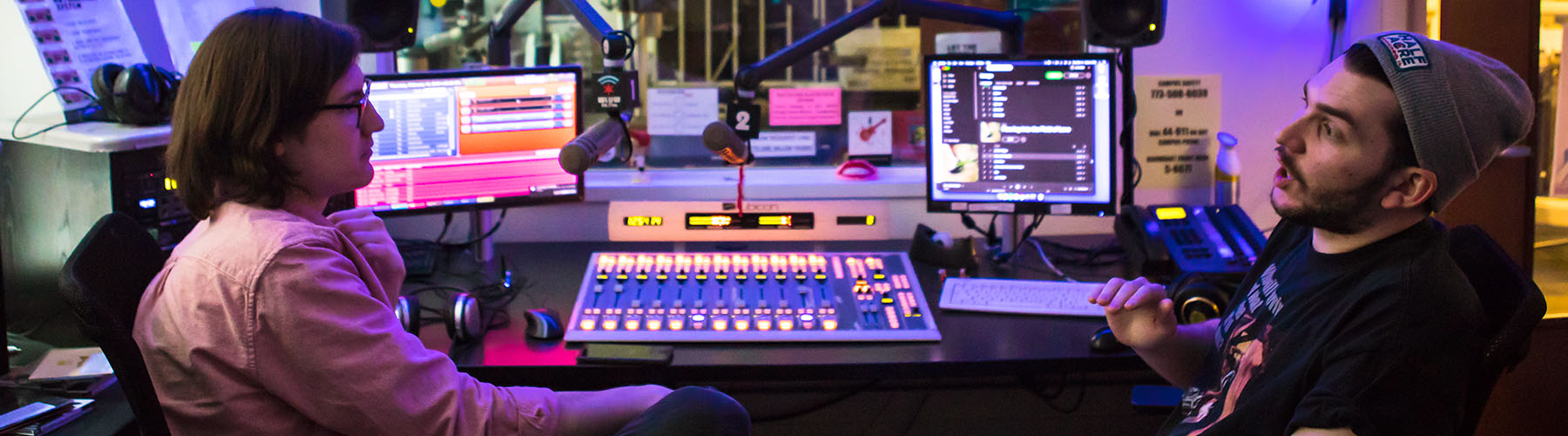 Loyola students talk at the WLUW radio station